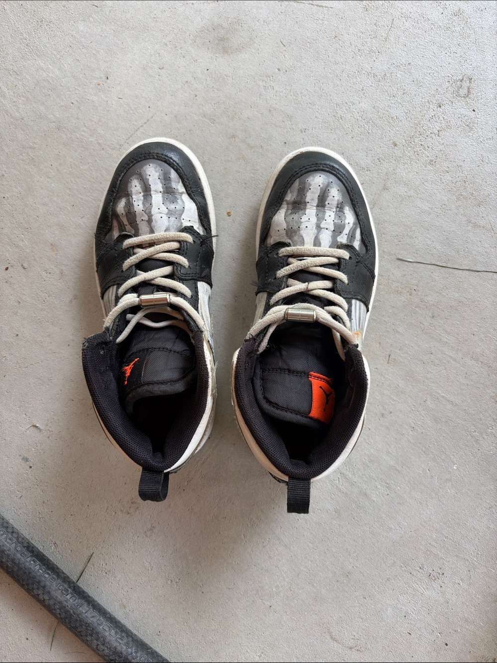 Nike Kids Black and White High-Top Sneakers with Orange Logo